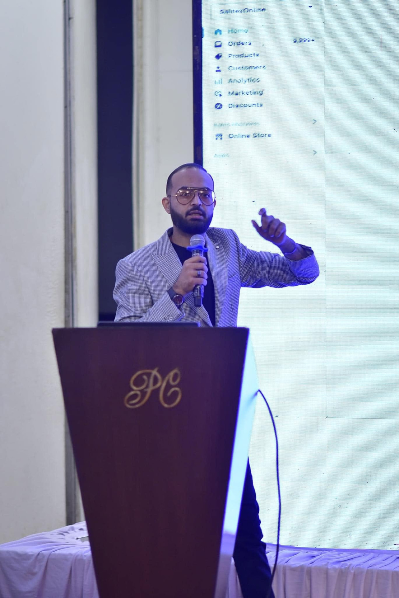 Basit speaking during a workshop